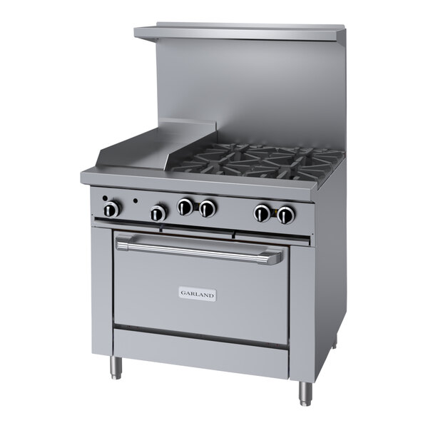 A large stainless steel Garland range with 4 burners, a griddle, and a convection oven.