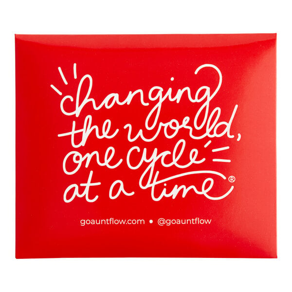 A red Aunt Flow sign with white text reading "changing the world one cycle at a time"