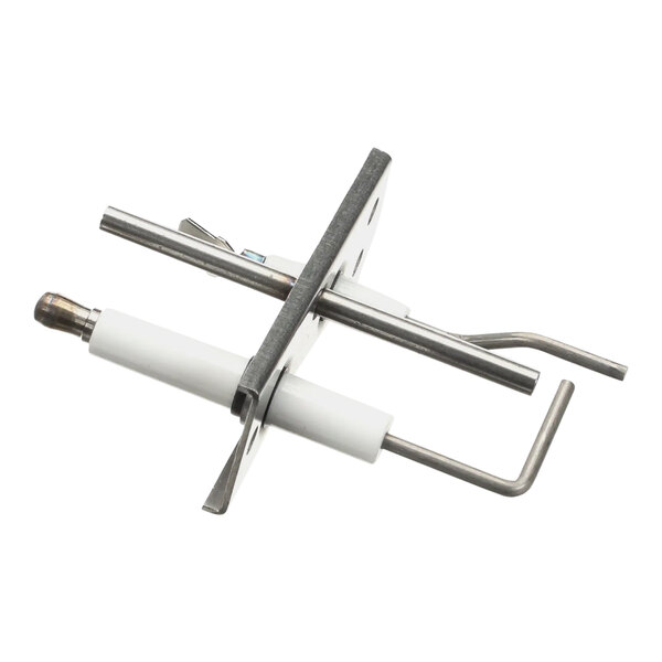 A close-up of a metal Vulcan pilot assembly with white accents.