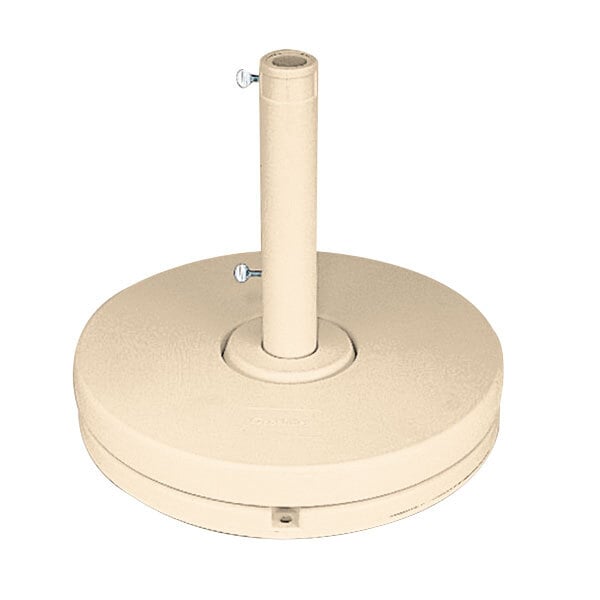 A white Grosfillex market umbrella base with a metal pole and round object.