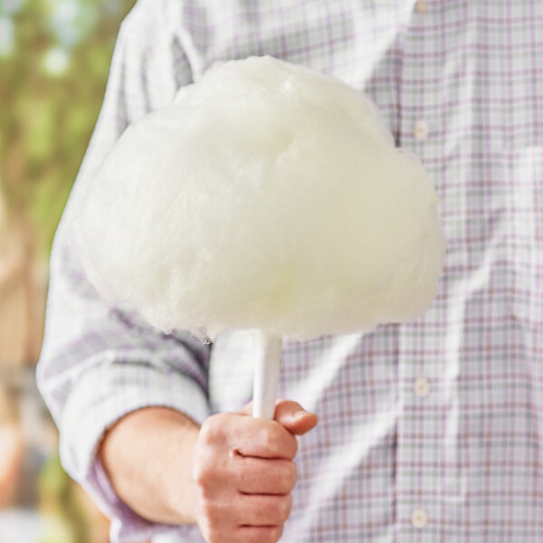 A man holding a Great Western 1/2 Gallon carton of apple cotton candy floss sugar.
