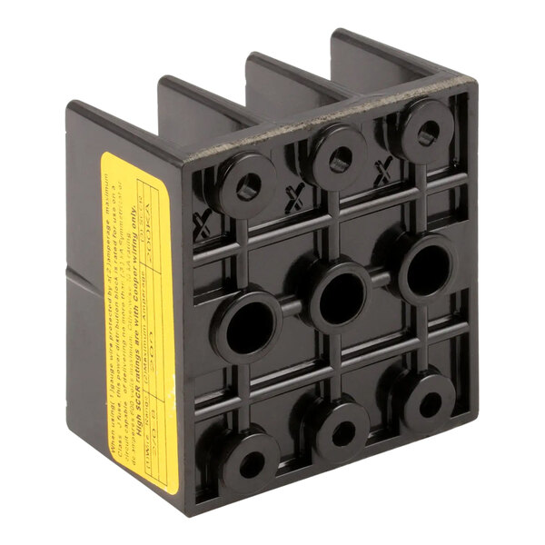 A black plastic block with three holes.