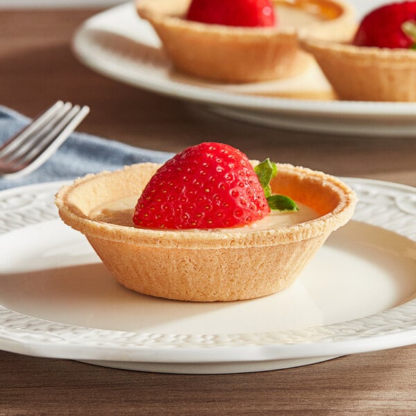 A KEEBLER Ready Crust Mini Graham Pie Shell with a strawberry on top.