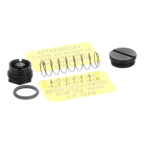A Pitco gas valve conversion kit with a circular object in the background.