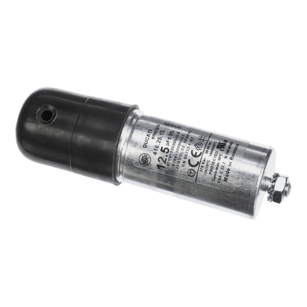 A close-up of a Vulcan motor capacitor with a black handle.