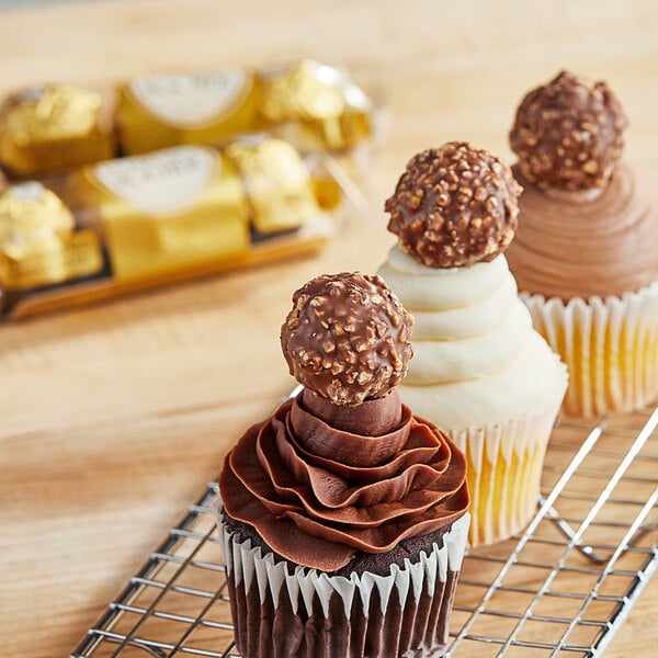 A group of FERRERO ROCHER Chocolate Hazelnut Pralines on a counter.
