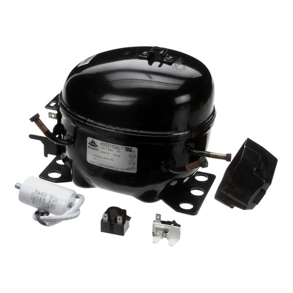 A black Turbo Air refrigeration compressor with parts.