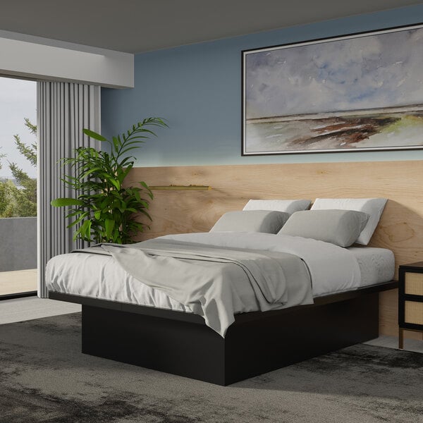 A Rize Home black steel king platform bed with wood panels.