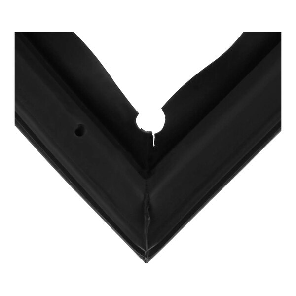 A close-up of a black corner of a Turbo Air Refrigeration gasket with a hole.