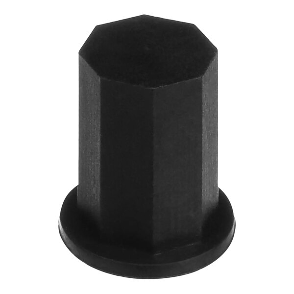 A close-up of a black hexagon shaped Vulcan knob core nut.