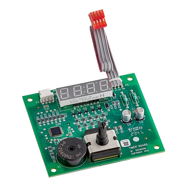 A green Vulcan Timer Board with a digital display.