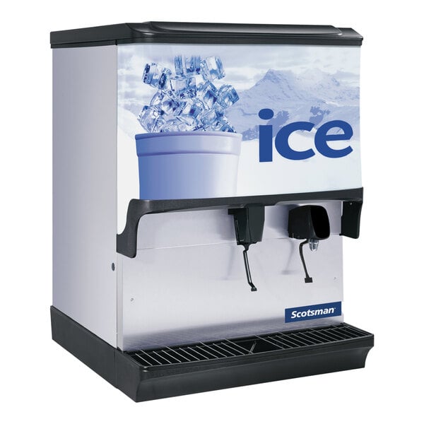 A Scotsman countertop ice dispenser with water on it and ice in a bucket.