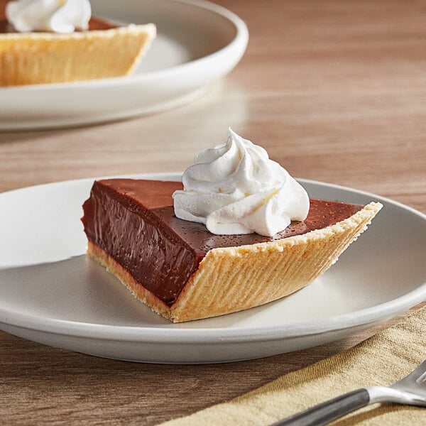 A slice of KEEBLER Ready Crust Shortbread pie with whipped cream on top.