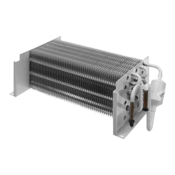 A close-up of a white Turbo Air Refrigeration evaporator coil with metal pipes.