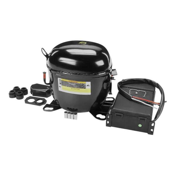 A black Turbo Air Refrigeration compressor with wires.