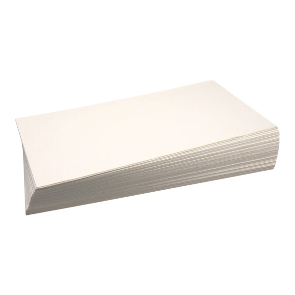 A stack of Imperial Range filter paper on a white surface.