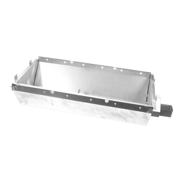 A metal Vulcan burner box with a metal plate and holes in it.