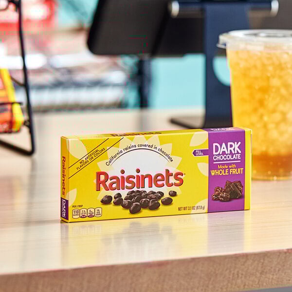 A yellow RAISINETS box on a table.
