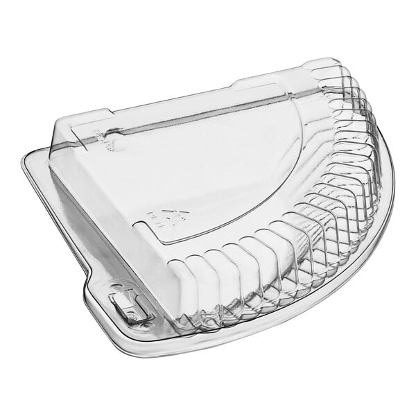 A Polar Pak clear plastic hinged 1/4 pie slice container with a lid.