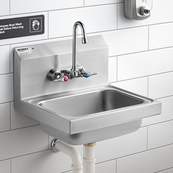 A Regency stainless steel wall-mounted hand sink with T&S faucet above it.