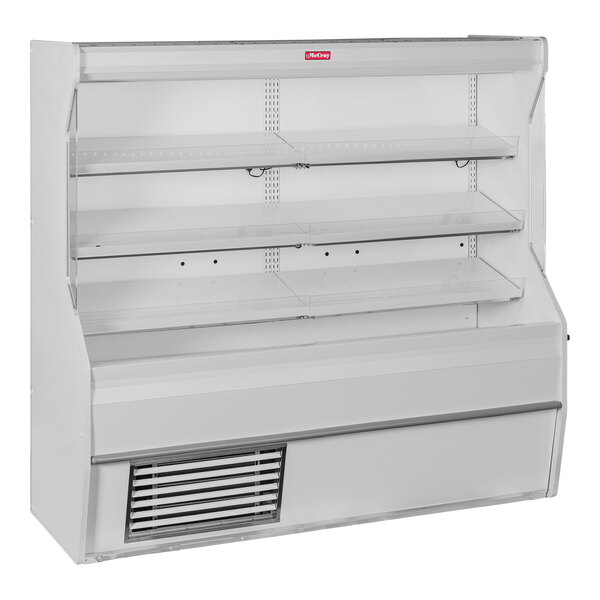A white Howard McCray vertical open air curtain meat merchandiser with shelves.