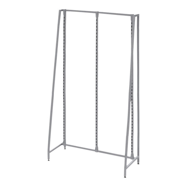 A silver metal Grand + Benedicts freestanding retail display system with shelves and a pole.