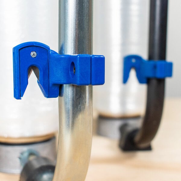 A blue Encore Packaging twine cutter attached to a metal pipe.