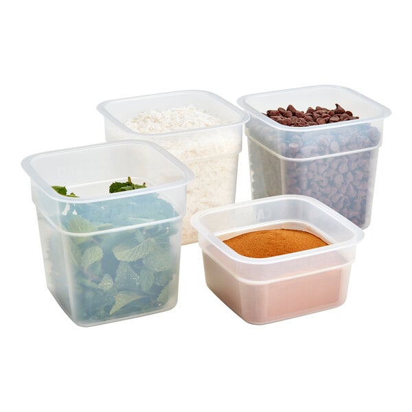A Cambro FreshPro food storage container set filled with chocolate chips, rice, vegetables, and spices.