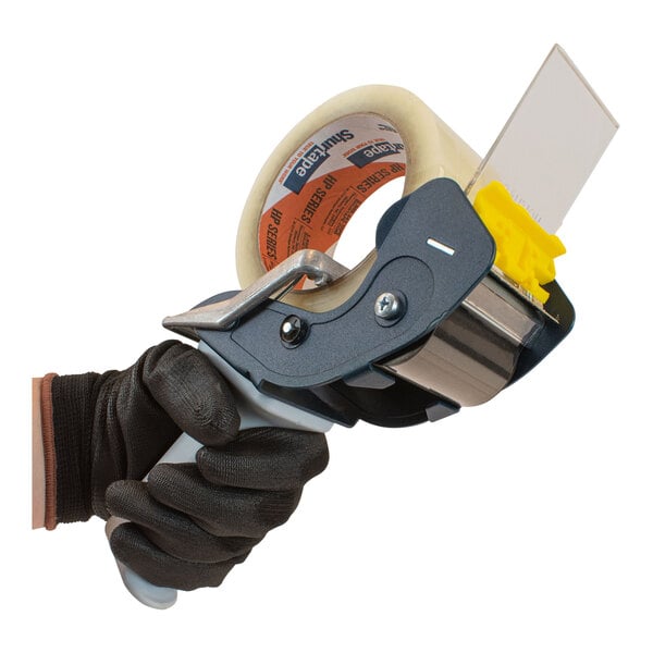 A hand using a Encore Packaging mousetrap-style tape dispenser to dispense clear tape.