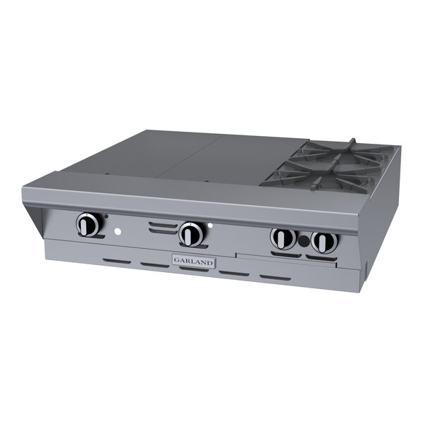 A stainless steel commercial range top with two burners and two even heat hot tops.