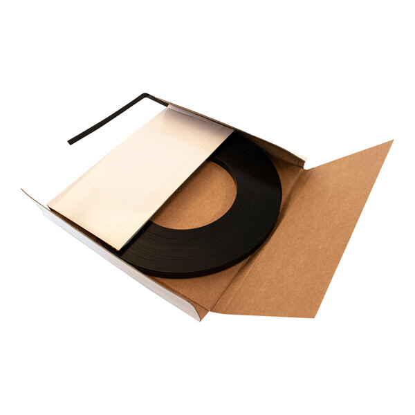 A box with a roll of black steel strapping coil.