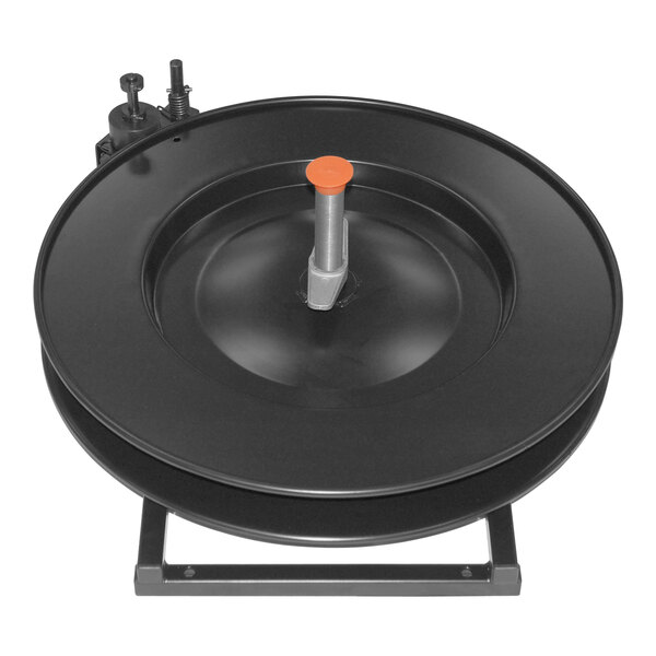 A black plastic round object with a metal handle.