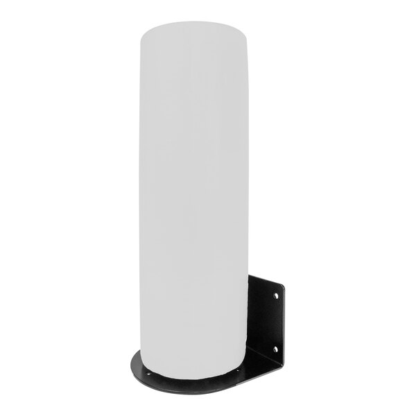 A white cylinder on a black metal surface.