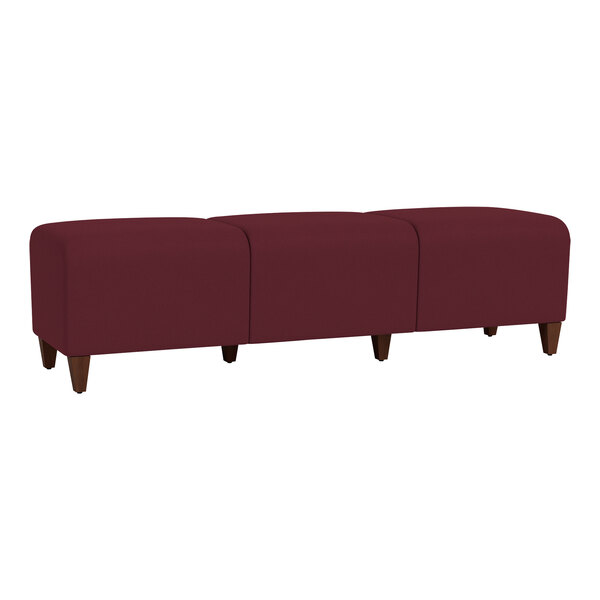 A red Lesro Ravenna bench with wooden legs.