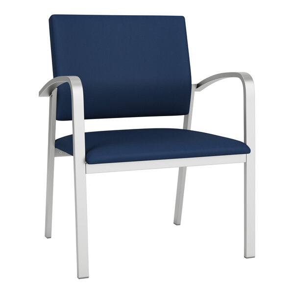 A Lesro Newport oversized guest chair with blue vinyl upholstery and silver arms and legs.