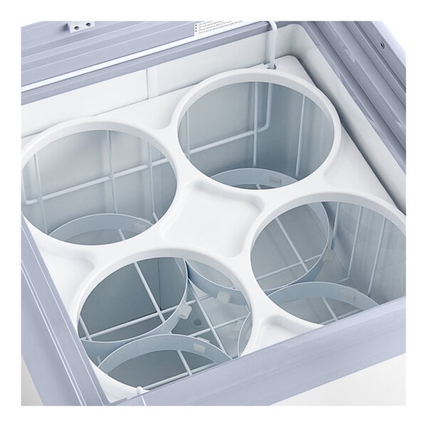 An Avantco white ice cream dipping cabinet with four circular compartments inside.