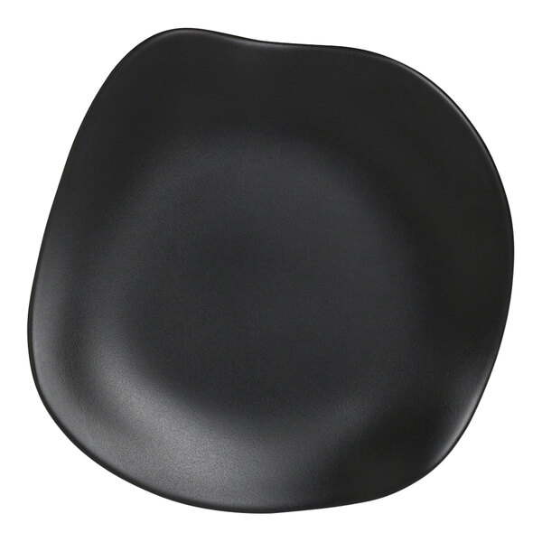 A black Delfin Marisol melamine plate with a curved edge.