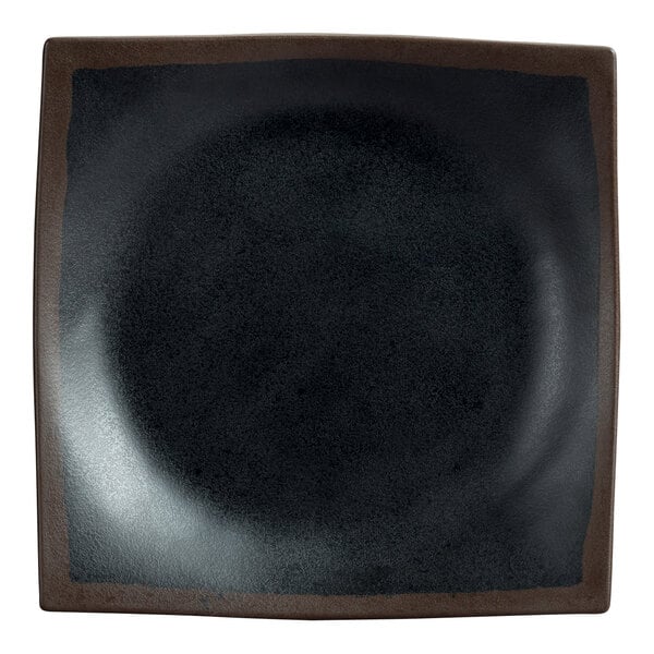 A Delfin Greystone black melamine plate with a brown border.