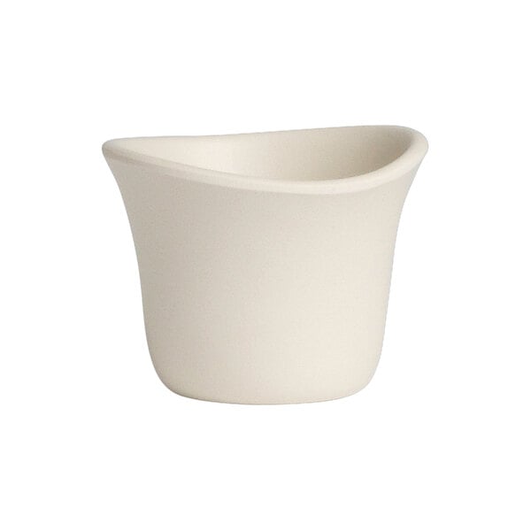 A white Delfin Marisol melamine sauce dish with a curved edge.