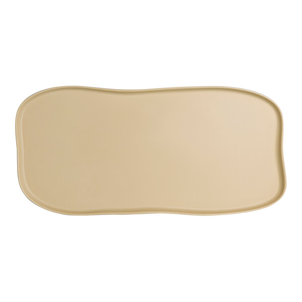 A tan rectangular Delfin Marisol platter with a curved edge.