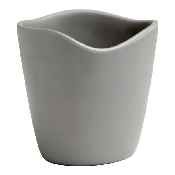 A Delfin Marisol Driftwood Gray melamine mini dressing crock with a curved edge.