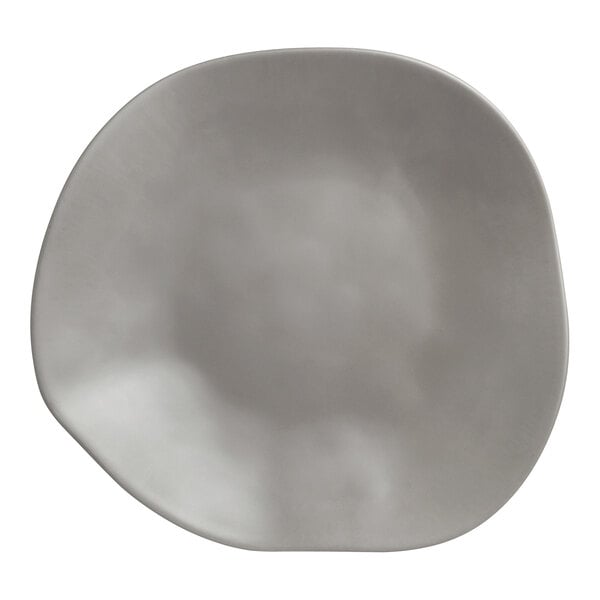 A Delfin Marisol driftwood gray melamine fruit platter with a wavy edge.