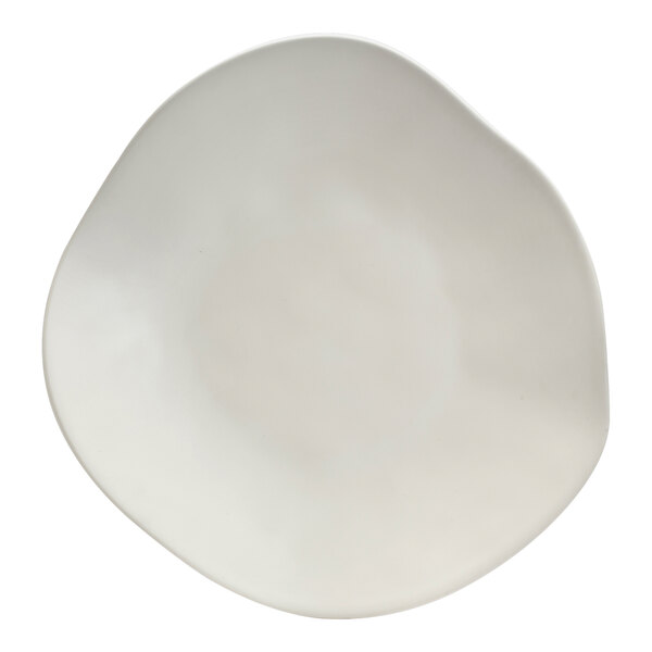 A white melamine fruit platter with a curved edge and a circular design on the bottom.