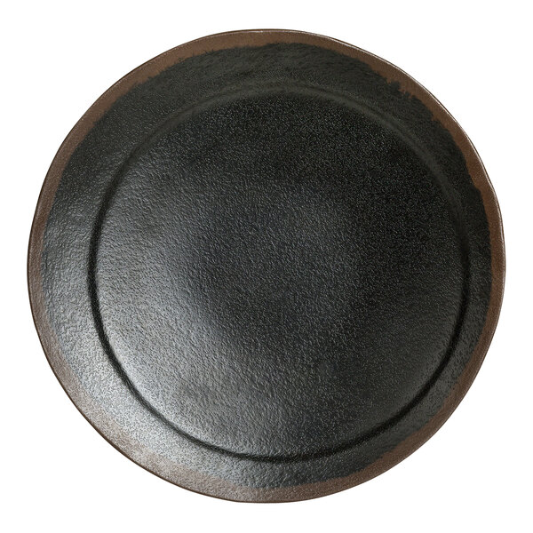 A black plate with a brown rim.