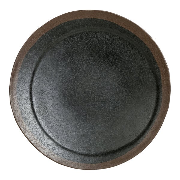 A Delfin Greystone black melamine plate with a brown rim.