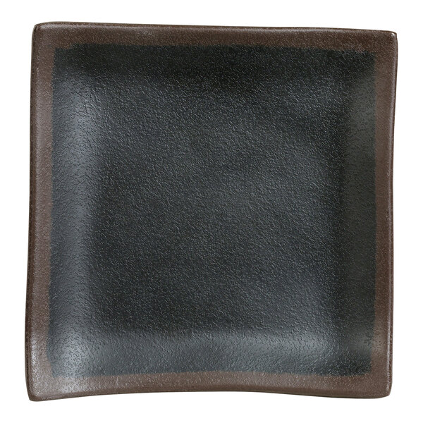 A Delfin Greystone from Steelite International black square melamine plate with a brown border.