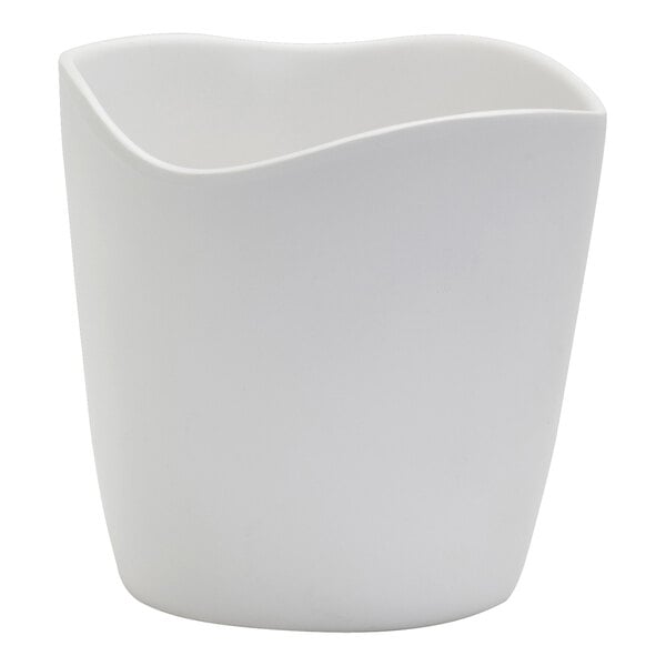 A white mini dressing crock with a curved edge.