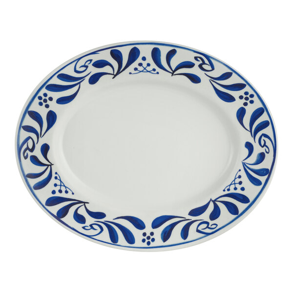 A white Delfin Viva melamine plate with a blue design on it.