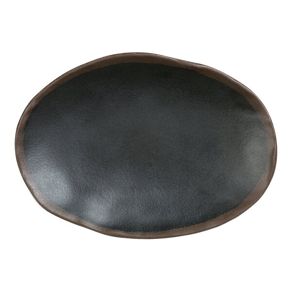 A black oval Delfin Greystone melamine plate with a brown edge.