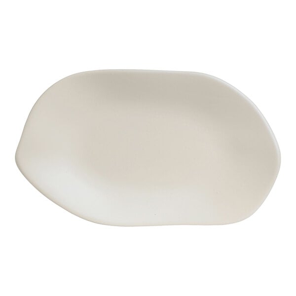 A white oval shaped Delfin Marisol melamine platter with a sand shell pattern.